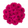 Růžové věčné růže v černém kulatém flowerboxu